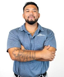 Professional roofing technician from Cool Roofs, wearing a blue polo shirt, showcasing expertise in roofing services and hail damage inspections.