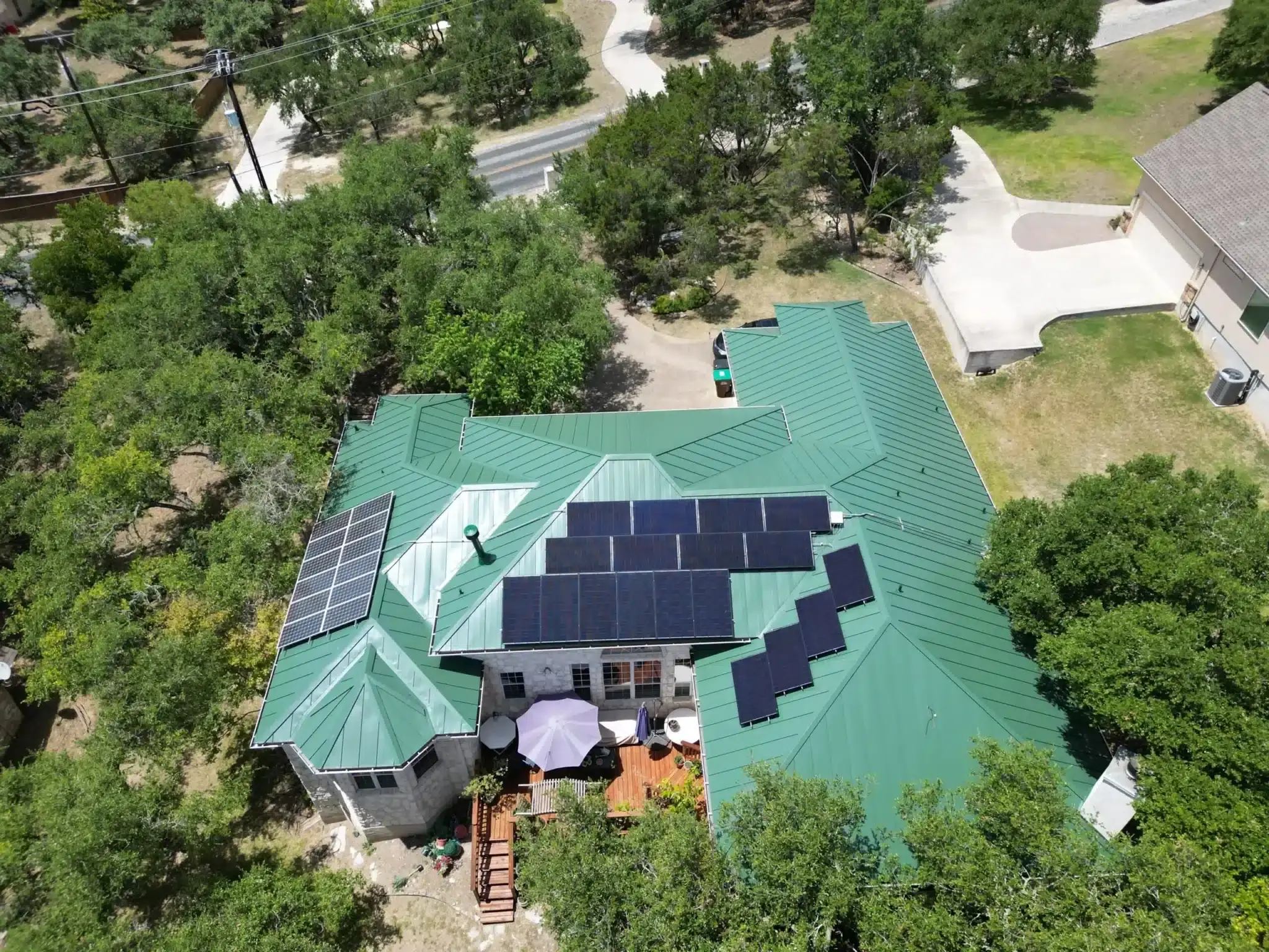 Metal roof with solar panel installation by Cool Roofs