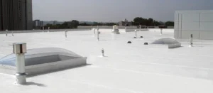 White PVC roofing system on commercial building, showcasing durability and energy efficiency.