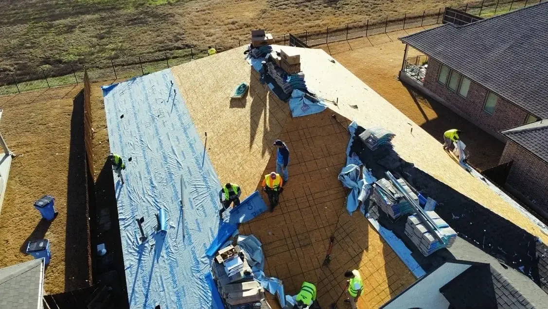 CoolRoofs roofing crew installing new asphalt shingles on Windcrest home.