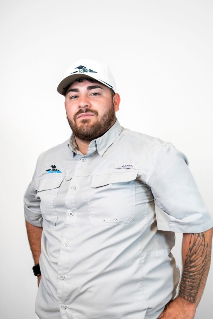 Cool Roofs team member in uniform, roofing specialist headshot