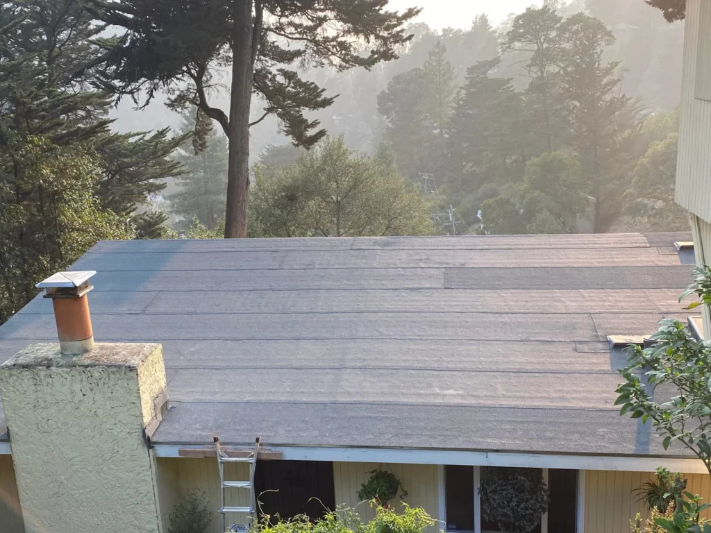 Modified bitumen flat roof and commercial roofing system restoration.