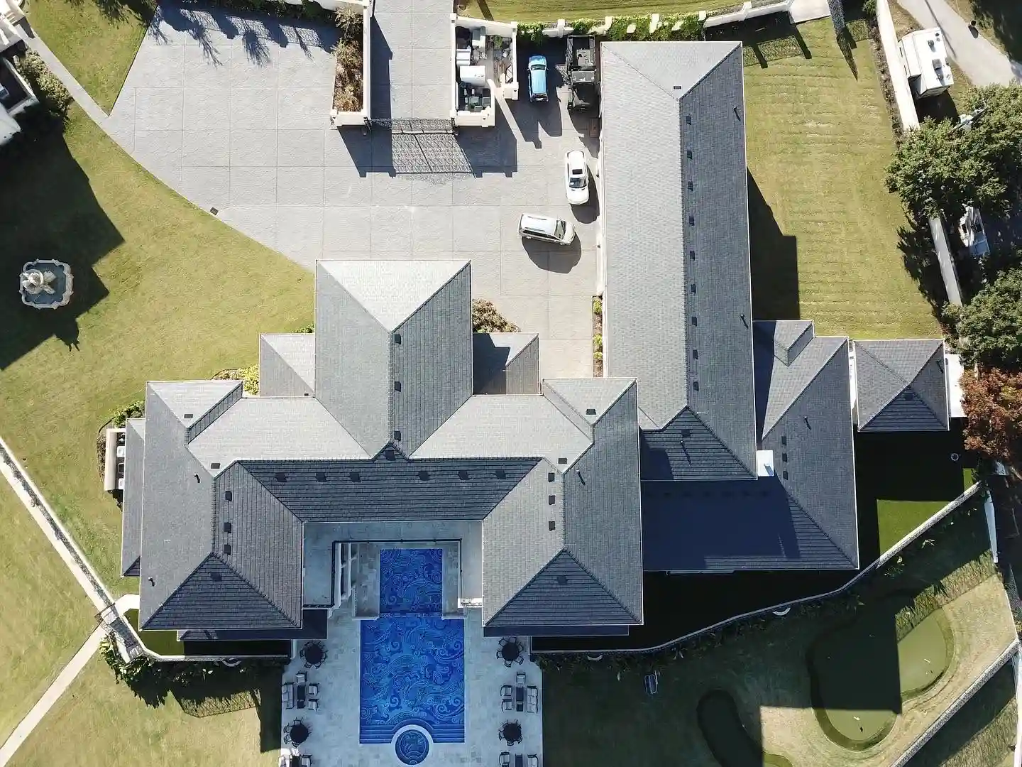Aerial view of a completed residential roof installation by Cool Roofs Inc.