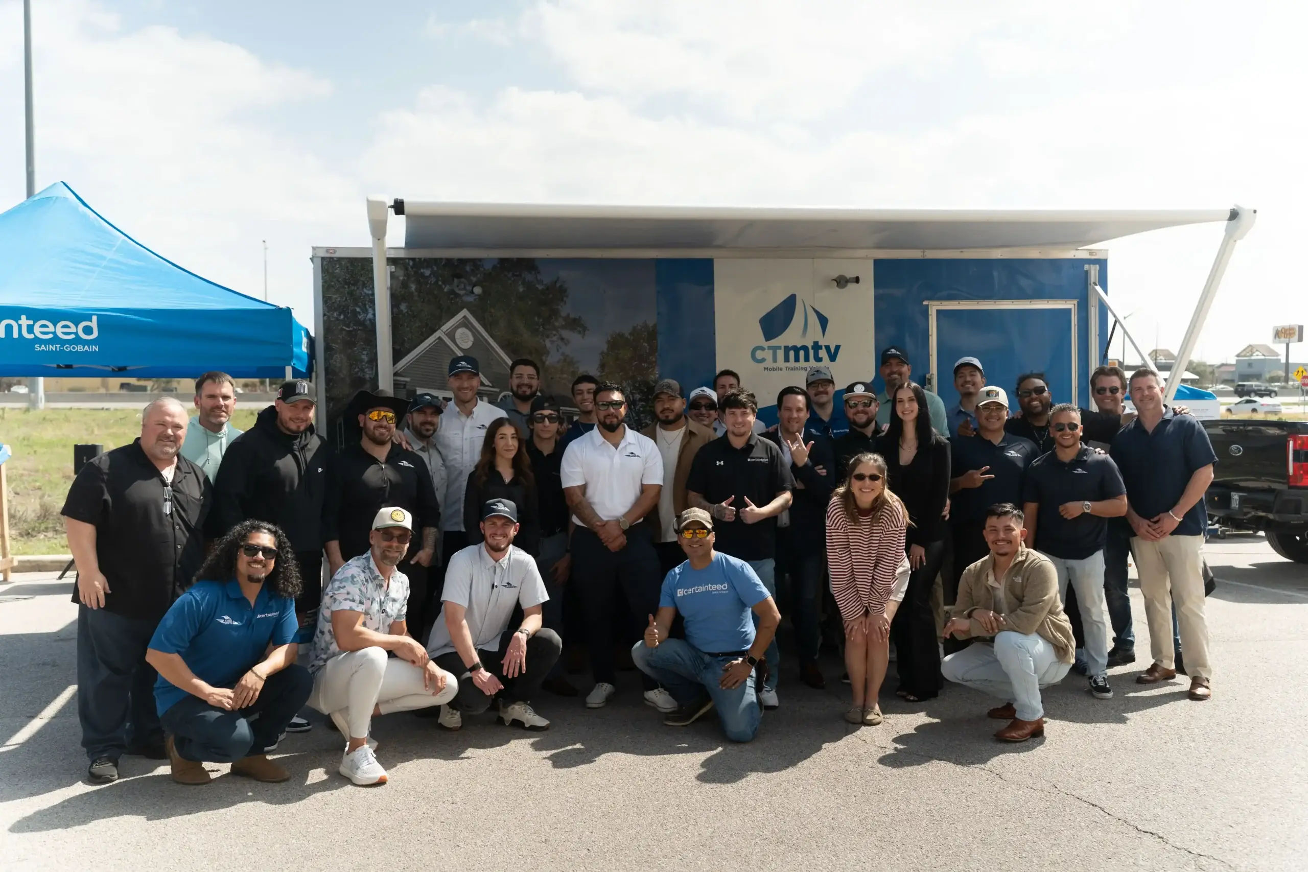 Cool Roofs sales team and partners at a roofing event, demonstrating a supportive sales system.