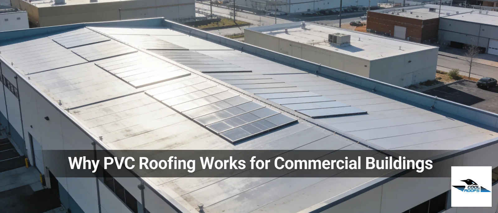 Commercial building with white PVC roofing and solar panels, Cool Roofs Inc. installation.